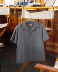 NYC Shirt in blue and white gingham seersucker on a hanger in the saloon of the Robert Gray