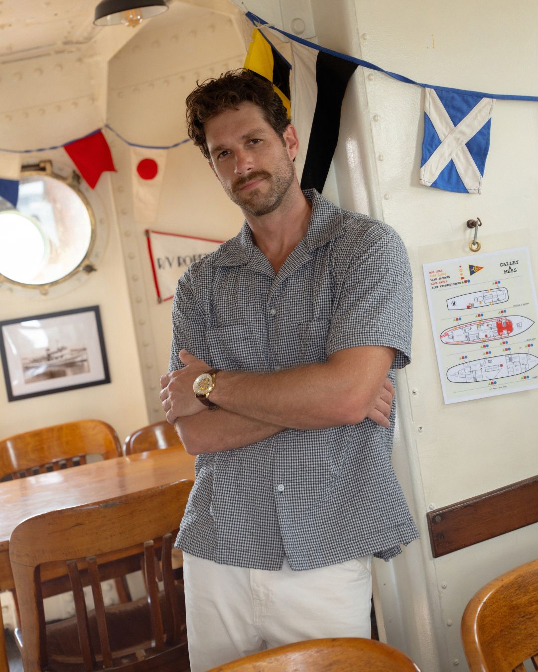 NYC Shirt worn with white trousers, arms crossed