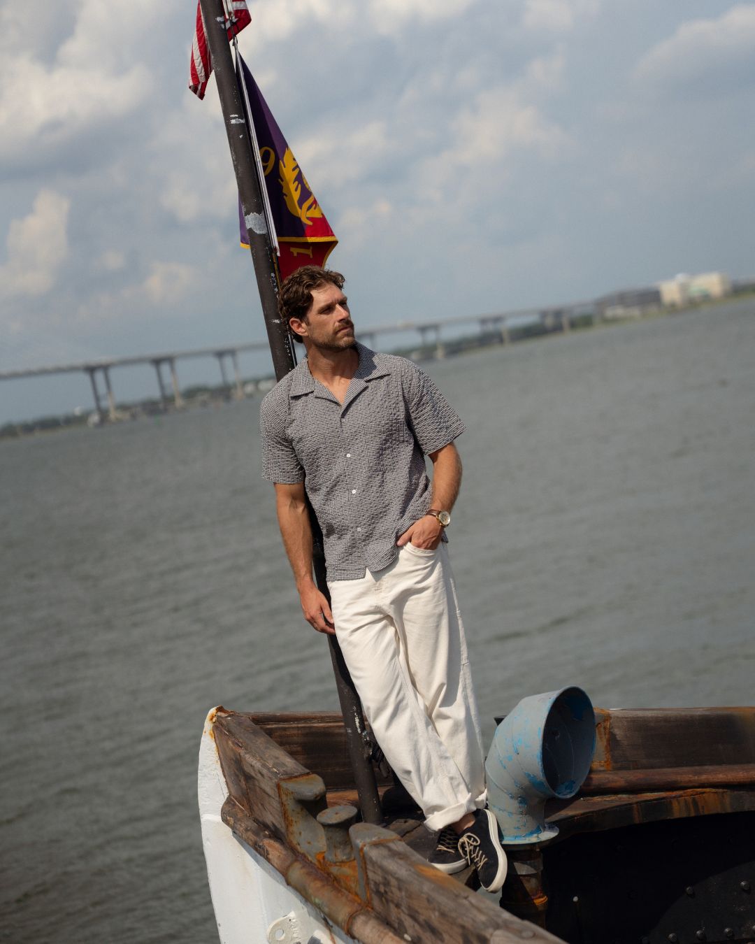 NYC Shirt worn on the bow under the burgee flag, Charleston harbor behind