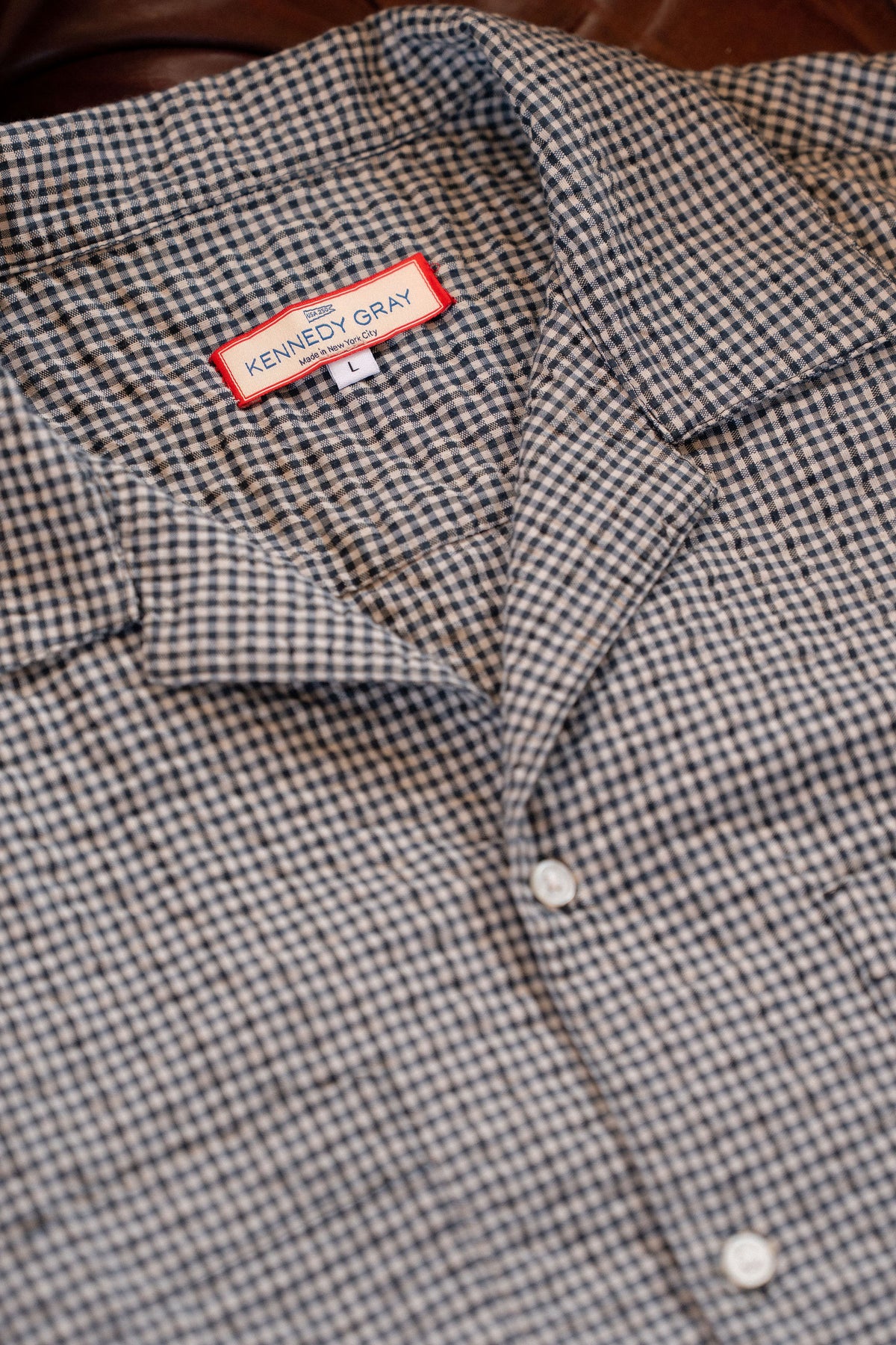 Camp collar and Kennedy Gray label of the NYC Shirt, close up