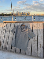 NYC Shirt laid flat on the deck with the Manhattan skyline behind